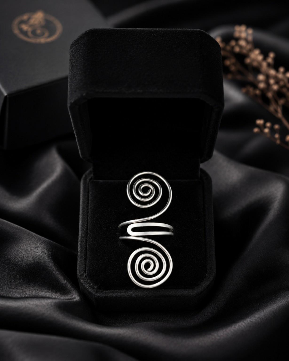 Close detail of heavy-gauge sterling silver wire wound into a spiral.