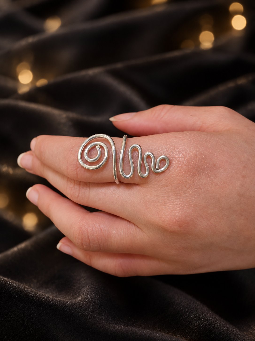 Silver Current ring, from the front.