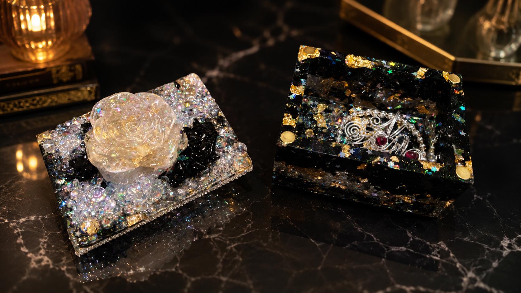 The Obsidian Rose box, a translucent sculpted rose set into a lid of iridescent crystal over deep black obsidian.